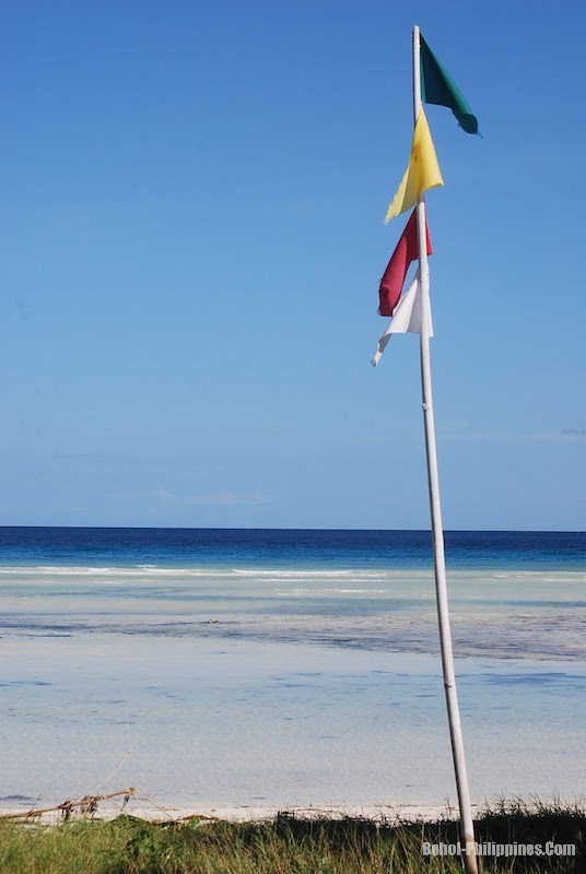 Flags at Anda Beach